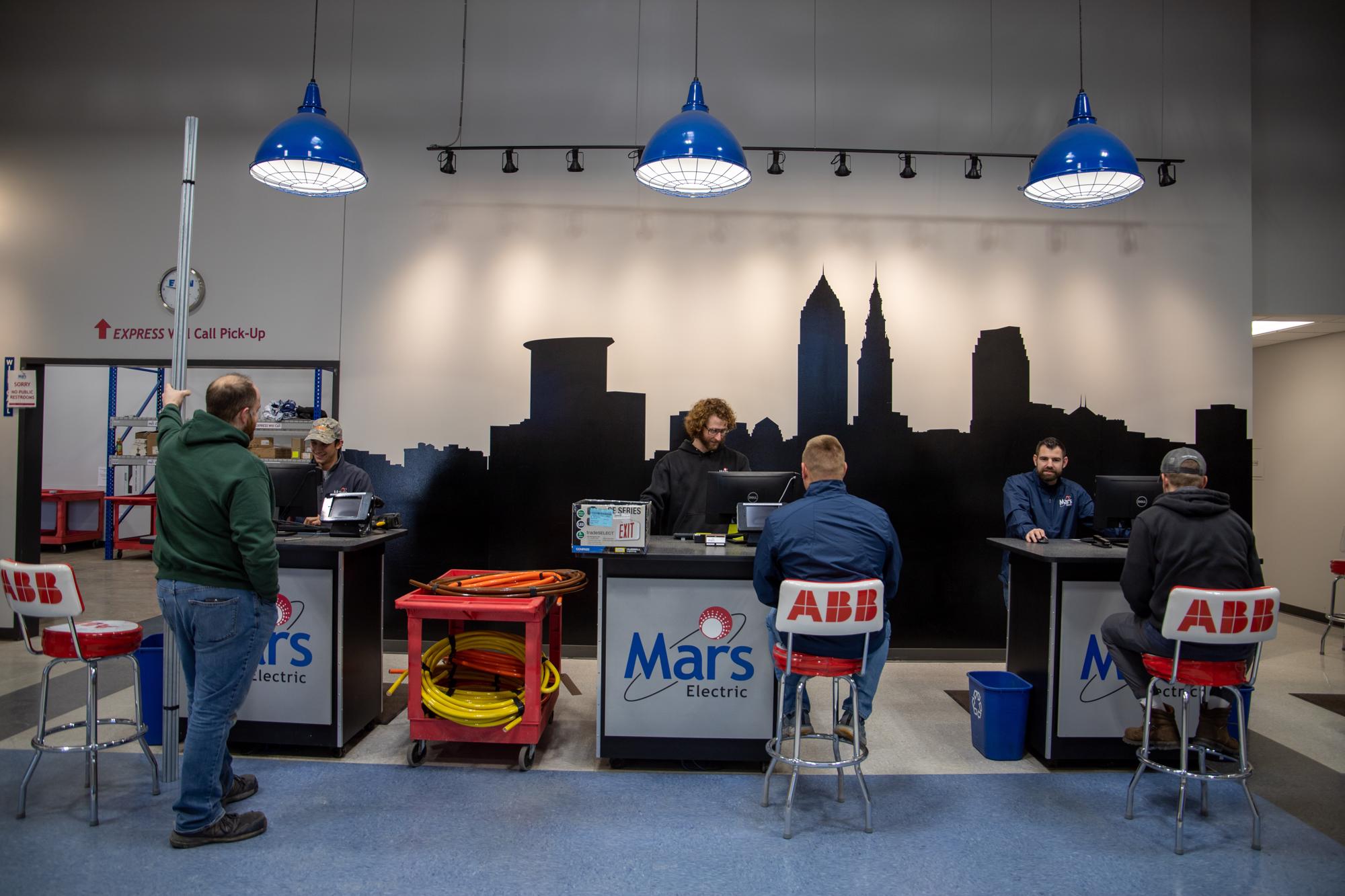 Mars Electric employees checking out customers at the Mayfield Village branch