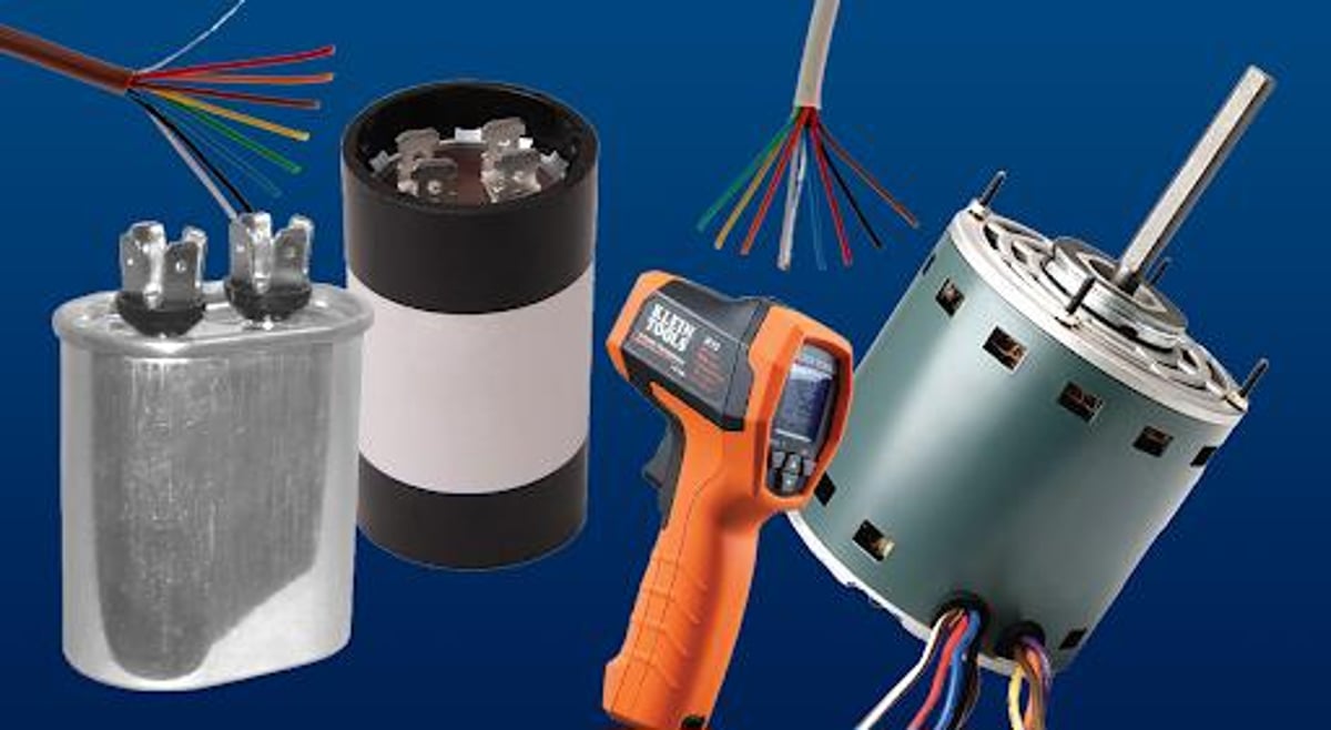 HVAC system parts and supplies including motor, capacitors, and other tools